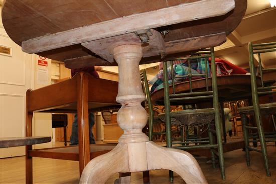 An early 19th century pine tea table